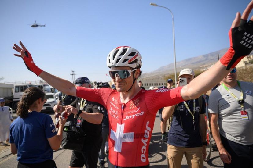 Team Jayco AlUla Swiss rider Mauro Schmid celebrates after winning the 3d stage of the Tour of Oman cycling race from Samail "Al Fayhaa Resthouse" to Misfat Al Abriyeen, on February 9, 2026. Loic VENANCE / AFP