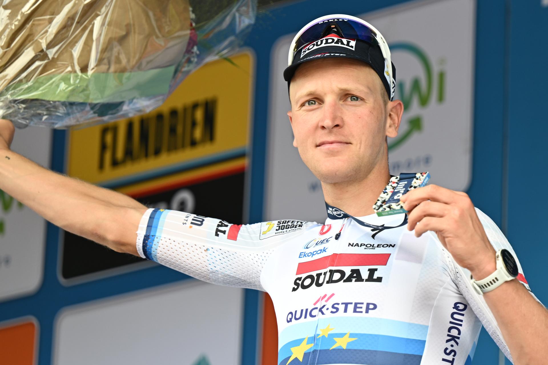 Belgian Tim Merlier of Soudal Quick-Step celebrates on the podium after winning the fourth stage of the 'Renewi Tour' multi-stage cycling race, from Riemst to Bilzen-Hoeselt (196 km) on Saturday 23 August 2025. The five-day race takes place in Belgium and the Netherlands. BELGA PHOTO DAVID PINTENS