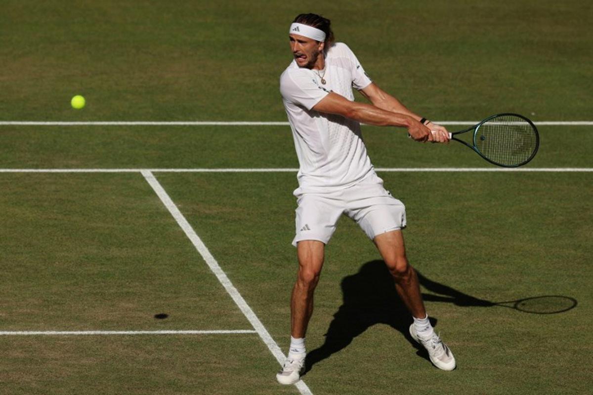Germany's Alexander Zverev returns to Italy's Jannik Sinner during their men's singles final tennis match on the fourteenth day of the 2026 Wimbledon Championships at The All England Lawn Tennis and Croquet Club in Wimbledon, southwest London, on July 12, 2026. Adrian Dennis / AFP