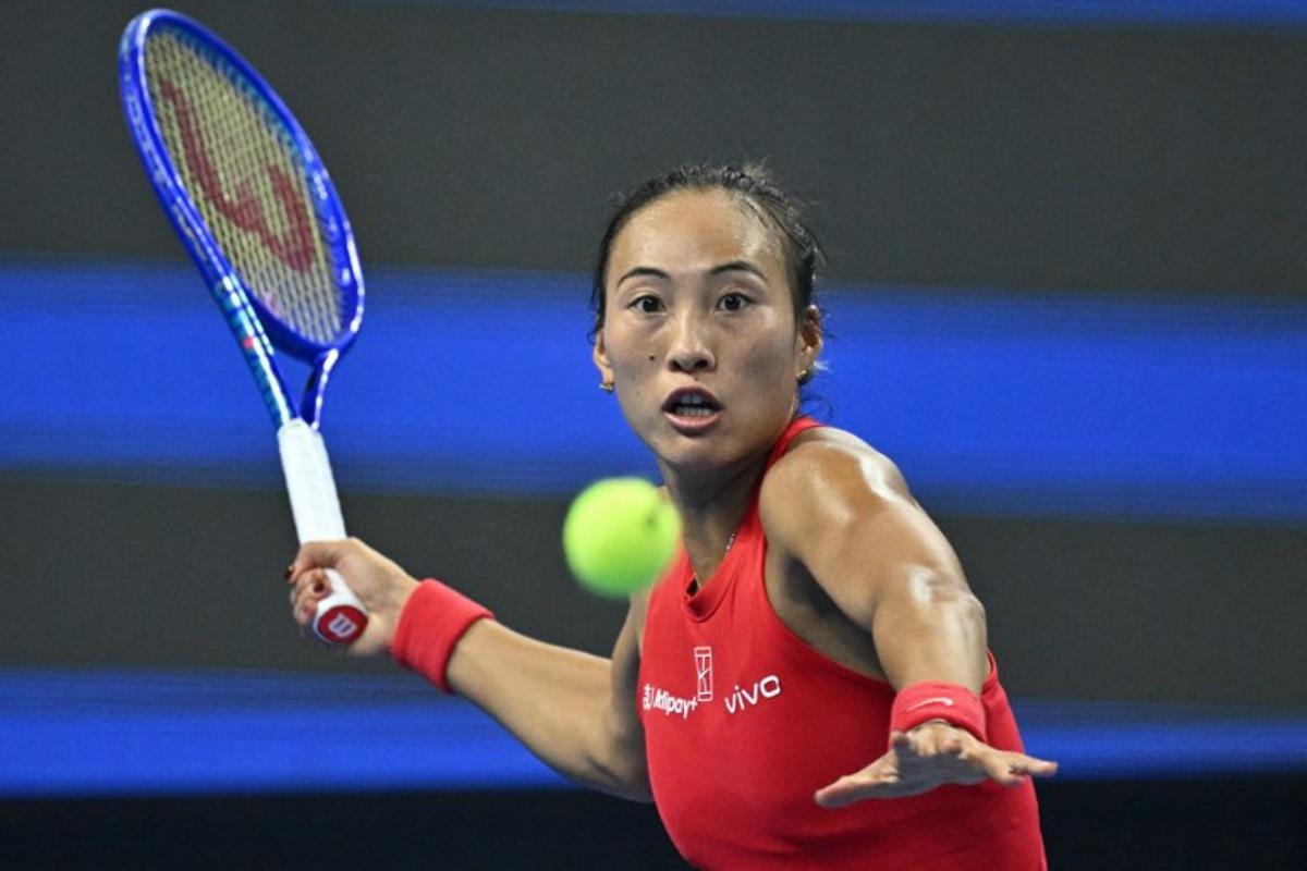 China's Zheng Qinwen hits a return to Russia's Mirra Andreeva during their women's singles final at the China Open tennis tournament in Beijing on October 11, 2026. Pedro Pardo / AFP