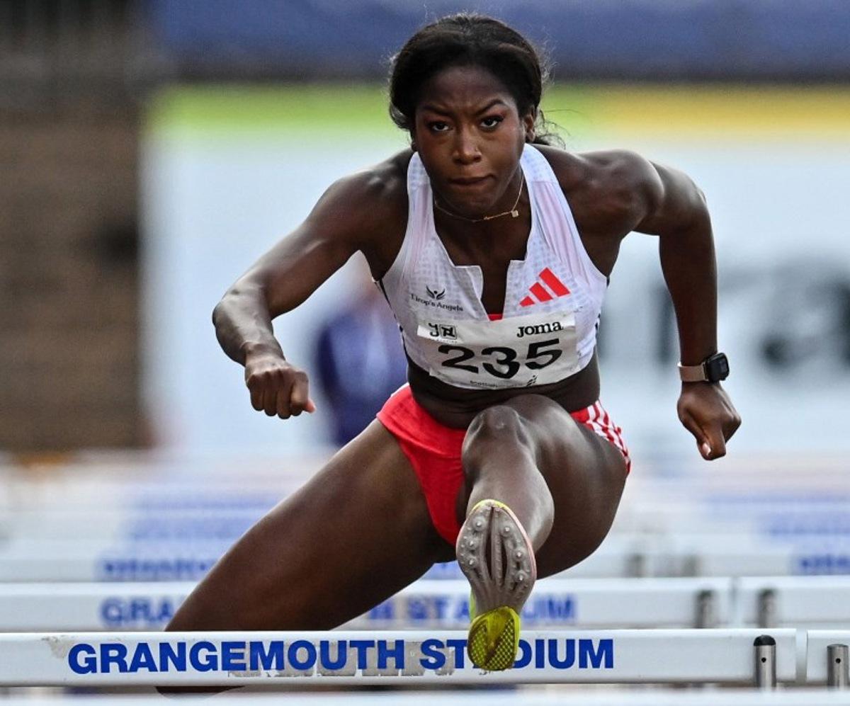 (FILES) France's Cyrena Samba-Mayela competes to take fourth place in Women's 100m hurdles final at the Scottish Athletics Championships at Grangemouth Stadium, in Grangemouth, Scotland on August 24, 2025. Hampered by injuries this season and not physically fit enough, Olympic 100m hurdles silver medallist Cyrena Samba-Mayela will not compete in the World Athletics Championships in Tokyo (September 13 to 21), the French hurdler announced on Instagram on August 25, 2025. Andy Buchanan / AFP