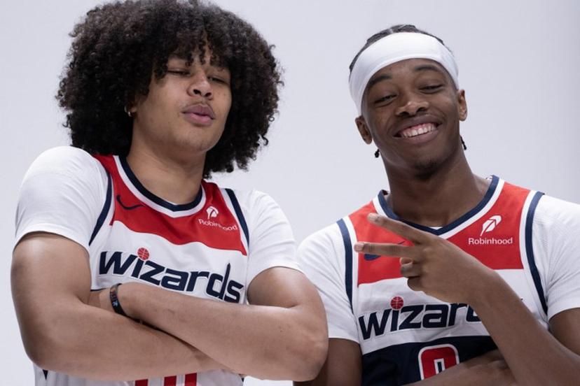 Bilal Coulibaly (R), French basketball player for the Washington Wizards, jokes around with Swiss teammate Kyshawn George at Wizards media day ahead of the NBA season at Capital One Arena in Washington, DC, September 30, 2024. ROBERTO SCHMIDT / AFP