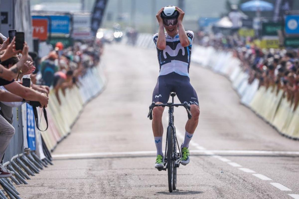 Movistar Team's Spanish rider Ivan Romeo Abad celebrates as he crosses the finish line to win the 3rd stage of the 77th edition of the Criterium du Dauphine cycling race, 207,2 km between Brioude and Charantonnay, on June 10, 2025. Anne-Christine POUJOULAT / AFP