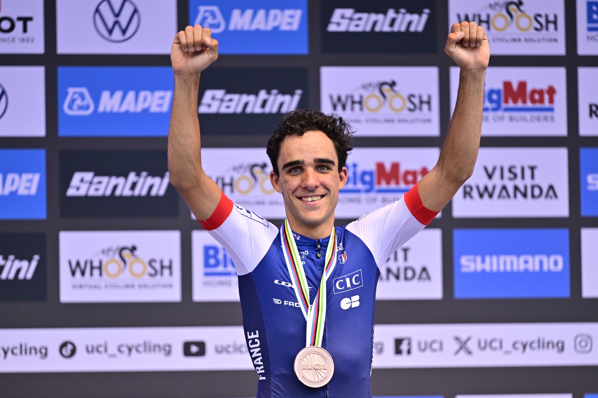 French Maxime Decomble celebrates on the podium with his bronze medal, after the Men U23 Individual Time Trial race (31,2km) at the cycling road world championships, in Kigali, Rwanda, Monday 22 September 2025. The 2025 UCI Road World Championships take place from 21 to 28 September in Kigali, Rwanda. BELGA PHOTO DIRK WAEM