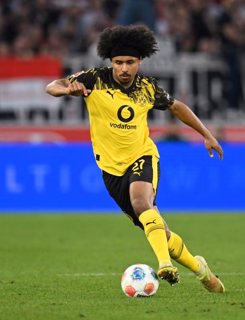 Dortmund's German forward #27 Karim Adeyemi plays the ball during the German first division Bundesliga football match between VfB Stuttgart and BVB Borussia Dortmund in Stuttgart, southern Germany, on April 4, 2026. THOMAS KIENZLE / AFP