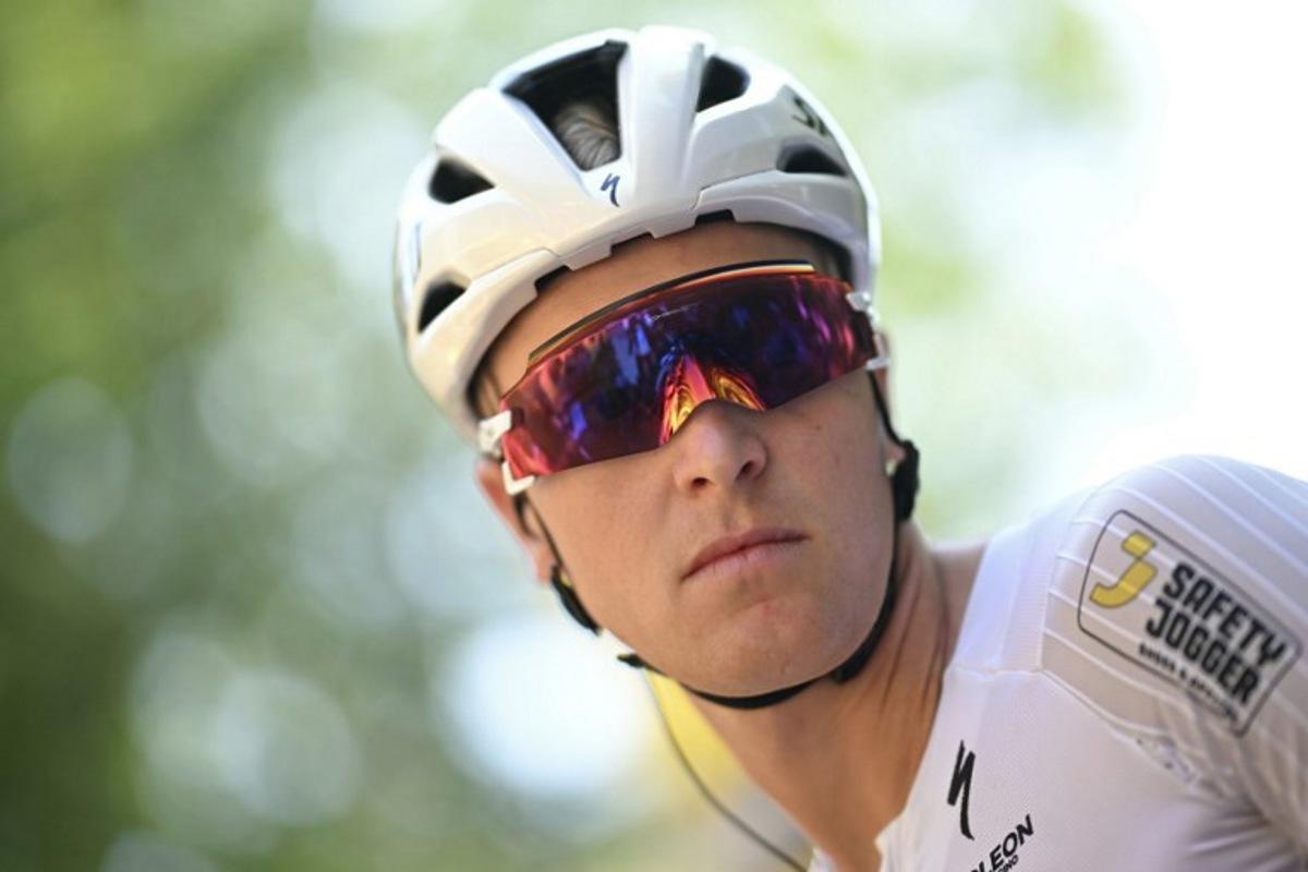 Soudal Quick-Step team's Belgian rider Tim Merlier awaits the start of the 9th stage of the 112th edition of the Tour de France cycling race, 174.1 km between Chinon and Chateauroux, central France, on July 13, 2025. Loic VENANCE / AFP