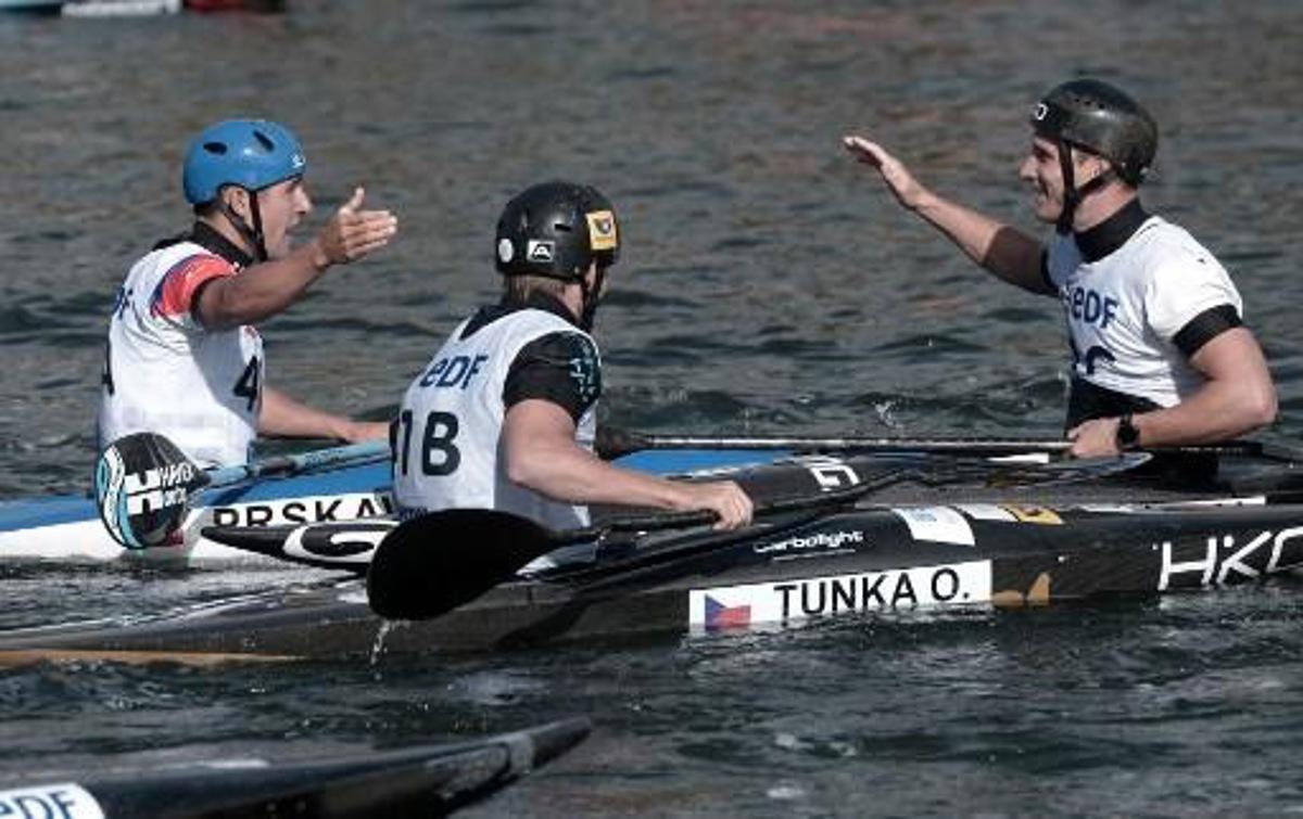 Czech Republic's (from L ) Jiri Prskavec, Tunka Ondrej and Prindis Vit react after they won the Kayak Men Teams final in the Kayak Men Team final at the 2017 ICF Canoe Slalom and Wildwater Canoeing World Championships in Pau, southern France, on September 26, 2017. IROZ GAIZKA / AFP