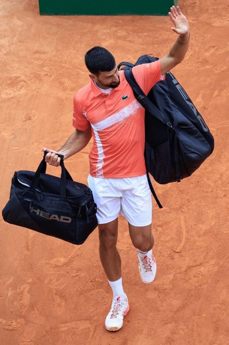 Serbia's Novak Djokovic leaves the court after losing against Chile's Alejandro Tabilo during the Monte Carlo ATP Masters Series Tournament round of 32 tennis match on the Rainier III court at the Monte Carlo Country Club in Roquebrune-Cap-Martin on April 9, 2025. Valery HACHE / AFP