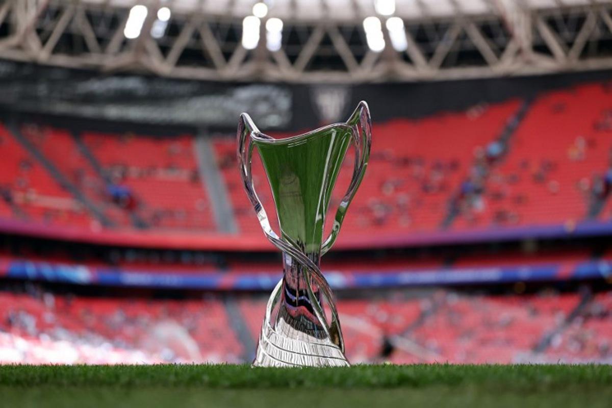 The championship's trophy is displayed on the pitch prior to the UEFA Women's Champions League final football match between FC Barcelona and Olympique Lyonnais at the San Mames stadium in Bilbao on May 25, 2024. Thomas COEX / AFP