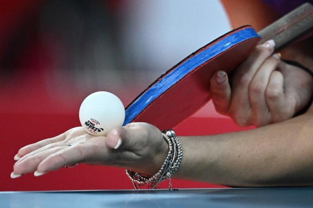 Romania's Bernadette Szocs serves to USA's Juan Liu during her women's singles round 3 table tennis match at the Tokyo Metropolitan Gymnasium during the Tokyo 2020 Olympic Games in Tokyo on July 27, 2021. Anne-Christine POUJOULAT / AFP
