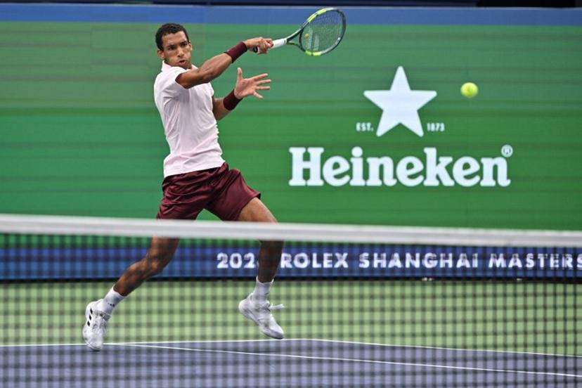 Canada's Felix Auger-Aliassime hits a return to Argentina's Camilo Ugo Carabelli during their men's singles match at the Shanghai Masters tennis tournament in Shanghai on October 10, 2026. Hector RETAMAL / AFP
