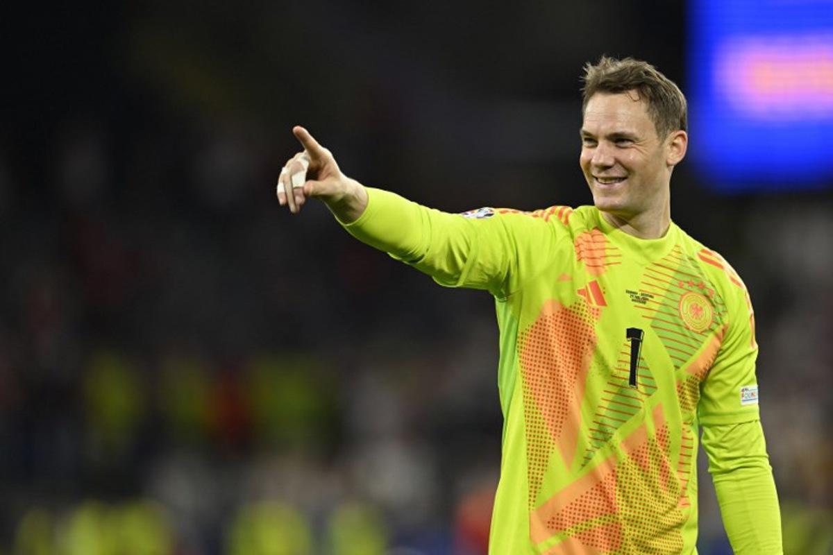 Germany's goalkeeper #01 Manuel Neuer celebrates his team's win at the end of the UEFA Euro 2024 round of 16 football match between Germany and Denmark at the BVB Stadion Dortmund in Dortmund on June 29, 2024. INA FASSBENDER / AFP