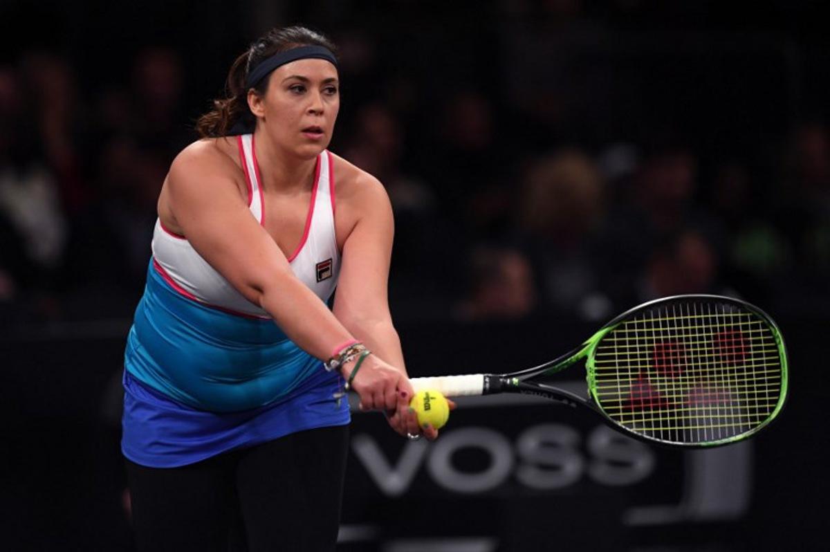 Marion Bartoli of France returns against Serena Williams of the US during the Tie Break Tens New York tournament at Madison Square Garden March 5, 2018 featuring eight of the tour's top female players competing for the $250,000 winner's prize. TIMOTHY A. CLARY / AFP