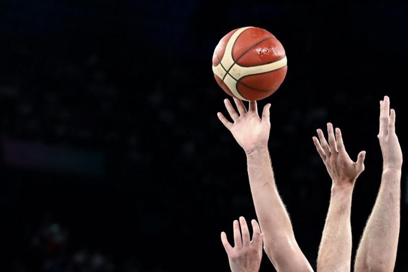 Players reach for the ball during the men's quarterfinal basketball match between Serbia and Australia during the Paris 2024 Olympic Games at the Bercy Arena in Paris on August 6, 2024. Aris MESSINIS / AFP