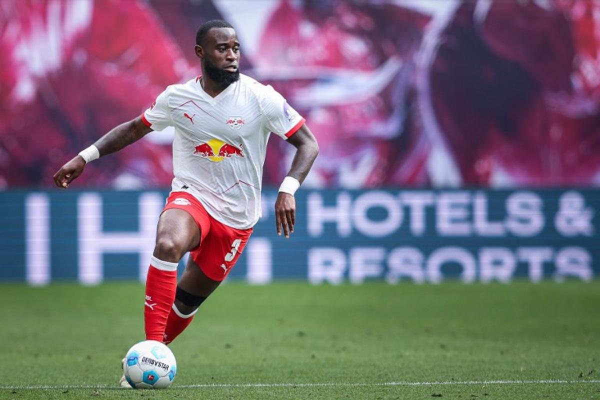 Leipzig's Dutch defender #03 Lutsharel Geertruida plays the ball during the German first division Bundesliga football match between RB Leipzig and VfB Stuttgart in Leipzig, eastern Germany, on May 17, 2025. Stuttgart won the match 3-2. Ronny Hartmann / AFP