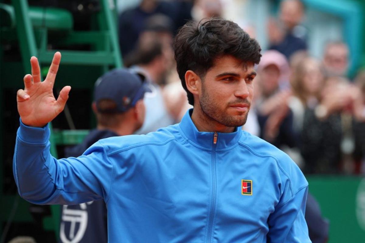 Spain's Carlos Alcaraz gestures after the Monte Carlo ATP Masters Series Tournament final tennis match against Italy's Jannik Sinner on Court Rainier III at the Monte-Carlo Country Club in Roquebrune-Cap-Martin, south-eastern France on April 12, 2026. Valery HACHE / AFP