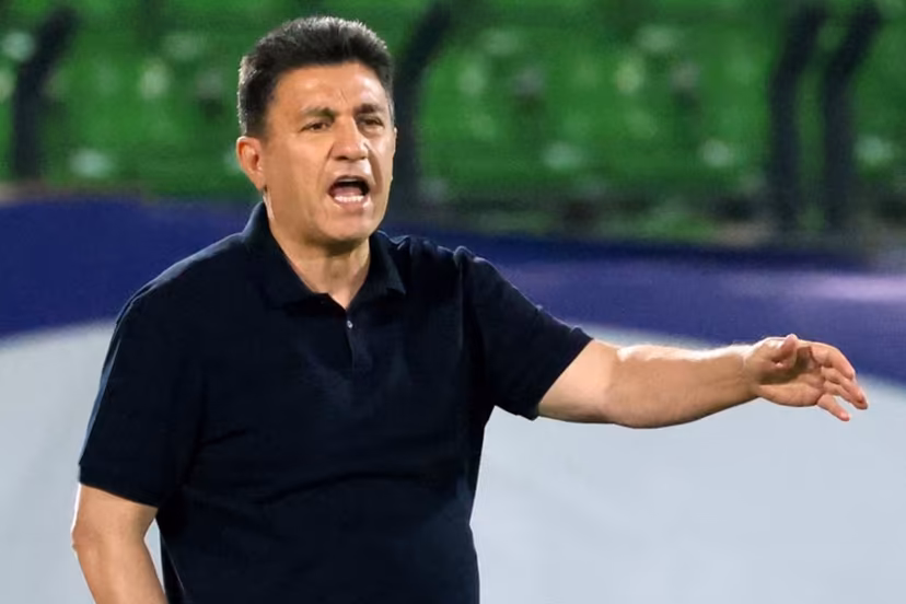 Iran's coach Amir Ghalenoei speaks to his players during the FIFA World Cup 2026 Asia zone qualifiers group A football match between Iran and the North Korea at the Azadi Sports Complex in Tehran on June 10, 2025. ATTA KENARE / AFP