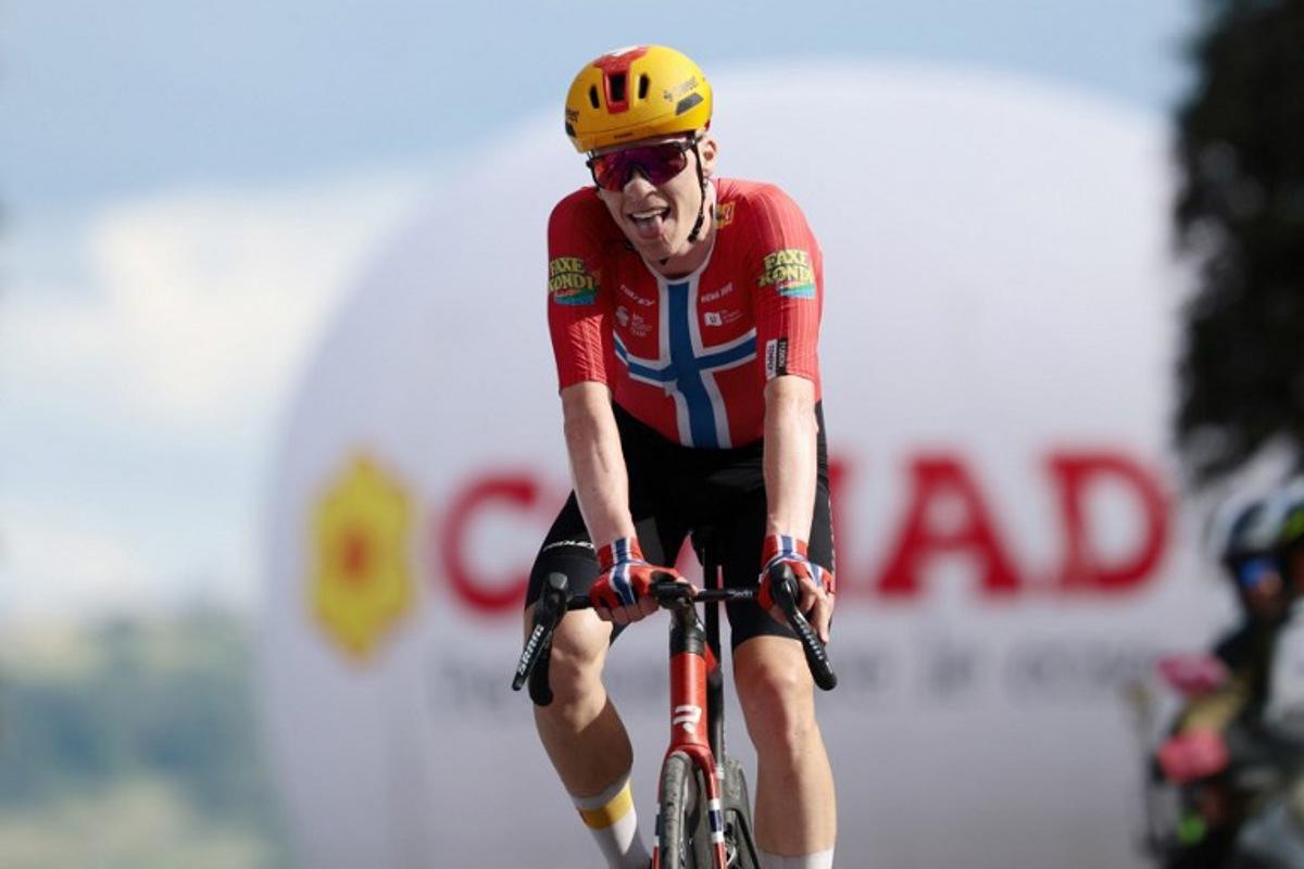 Second-placed Uno X Mobility Norwegian rider Andreas Leknessund celebrates as he crosses the finish line at the end of the 8th stage of the Giro d'Italia 2026 - Tour of Italy cycling race between Chieti and Fermo, central Italy on May 16, 2026. Luca Bettini / AFP