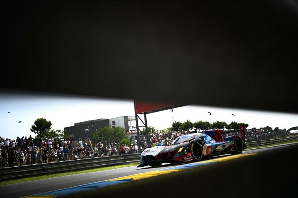 This photograph shows BMW M Team WRT's car driven by Danish Kevin Magnussen, Italian Raffaele Marciello and Belgian Dries Vanthoor during the 94th edition of the 24 Hours of Le Mans at the Le Mans circuit, north-western France on June 13, 2026. Lou BENOIST / AFP
