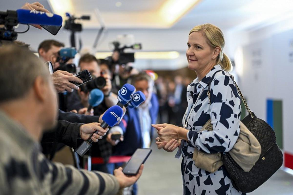 Candidate to the presidency of the International Olympic Committee (IOC) Kirsty Coventry speaks to the press during the 144th IOC Session in Costa Navarino, Greece, where the next IOC President will be elected, on March 19, 2025. The election between seven canditates will take place on March 20, 2025. Fabrice COFFRINI / AFP