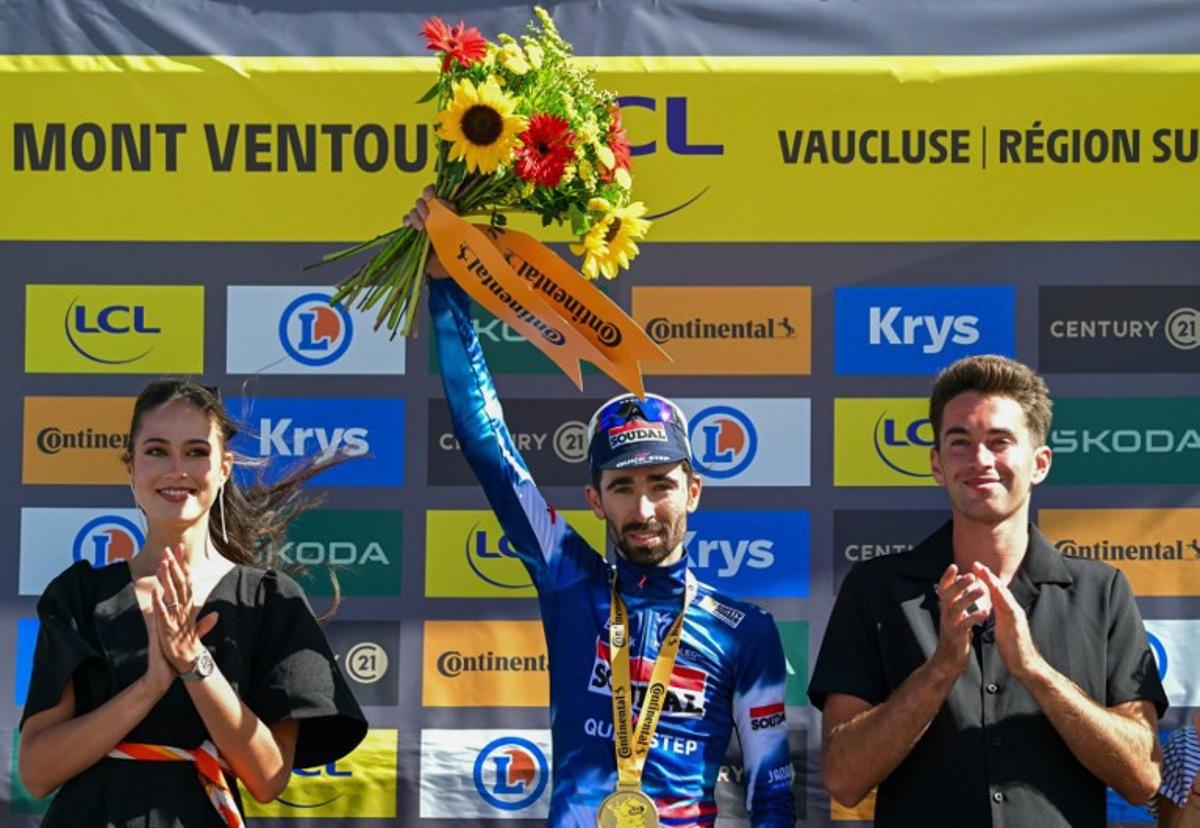 Soudal Quick-Step team's French rider Valentin Paret-Peintre celebrates on the podium after winning the 16th stage of the 112th edition of the Tour de France cycling race, 171.5 km between Montpellier and Mont Ventoux, southern France, on July 22, 2025. Loic VENANCE / AFP