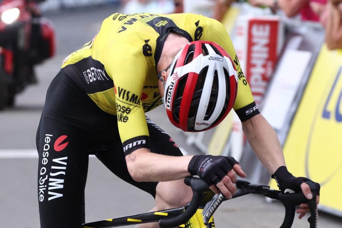 Team Visma - Lease a Bike's Danish rider Jonas Vingegaard reacts as he crosses the finish line the 7th stage of the 77th edition of the Criterium du Dauphine cycling race, 131,6 km between Grand-Aigueblanche and Valmeinier, on June 14, 2025. Anne-Christine POUJOULAT / AFP