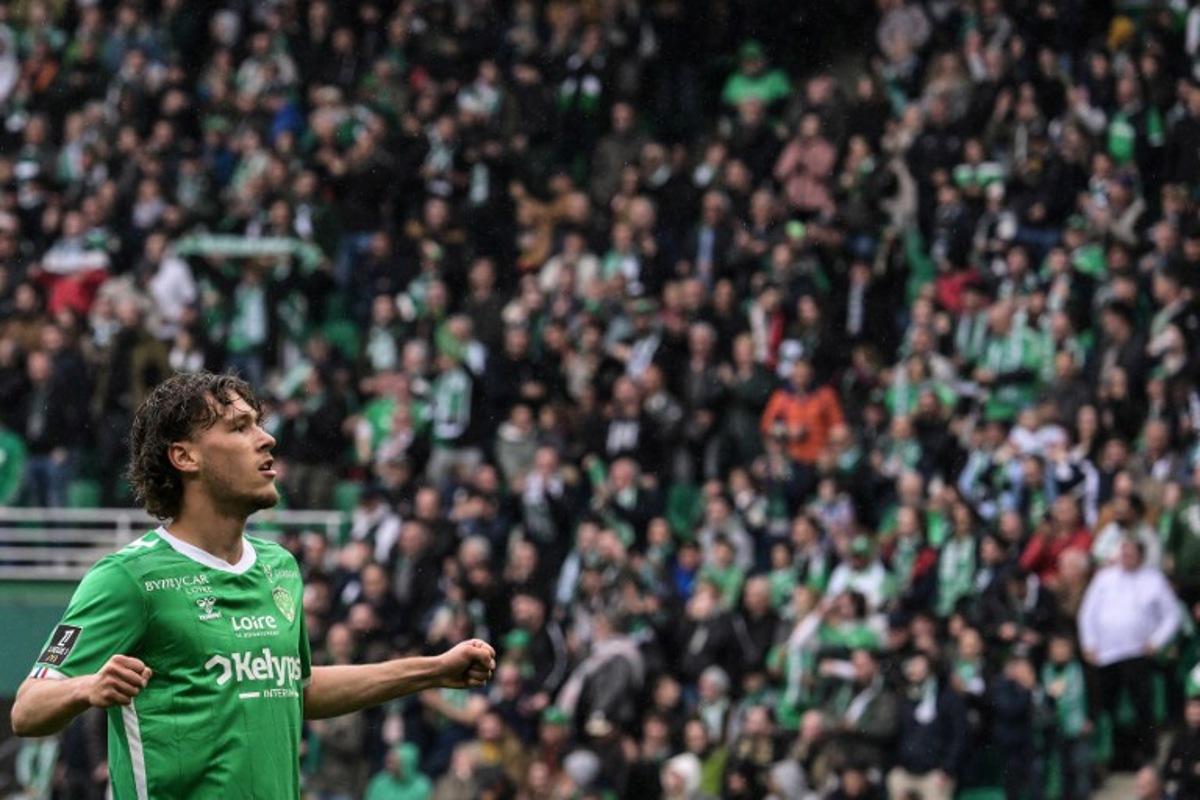Saint Etienne's Belgian forward #32 Lucas Stassin celebrates after scoring his team's first goal during the French L1 football match between AS Saint-Etienne and Stade Brestois 29 at the Geoffroy-Guichard Stadium in Saint-Etienne, central France on April 13, 2025. JEAN-PHILIPPE KSIAZEK / AFP