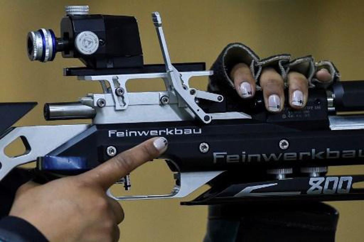Colombian Angela Rodriguez competes in the Women's 10m Air Rifle Shooting Final at the XVIII Juegos Bolivarianos in Cali, Colombia, on November 13, 2017. LUIS ROBAYO / AFP