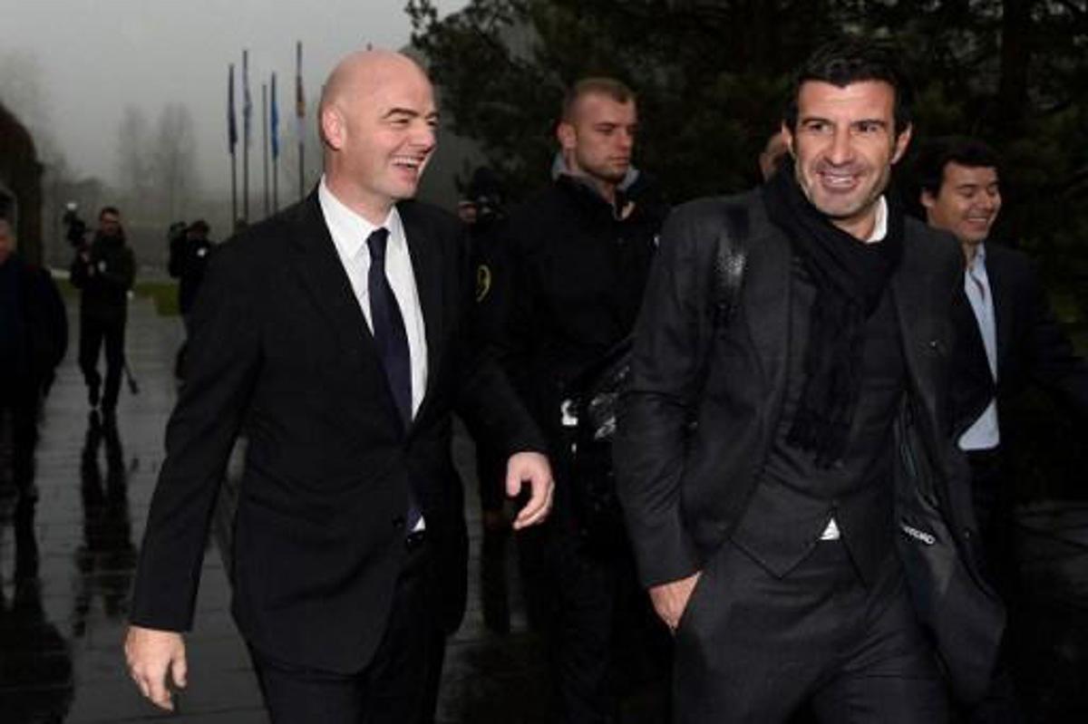 Newly-elected FIFA president Gianni Infantino (L) and former Portuguese international player Luis Figo (R) arrive at the FIFA headquarters on February 29, 2016 in Zurich. Gianni Infantino insisted on February 28, 2016 that FIFA's reform package would close the door on a chapter of pain at world football's governing body and usher in an era of joy. / AFP / VALERIANO DI DOMENICO