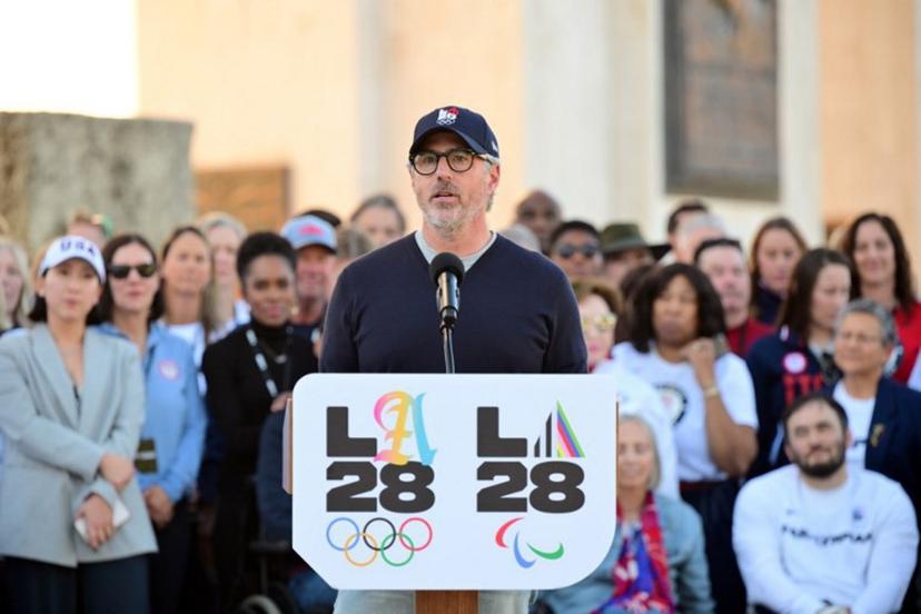 Chairman of the LA2028 Olympics Organizing Committee Casey Wasserman speaks during a ceremonial lighting of the LA28 Olympic cauldron at the Memorial Coliseum in Los Angeles on January 13, 2026, ahead of the launch of ticket registration for the 2028 Summer Olympic Games. Frederic J. Brown / AFP