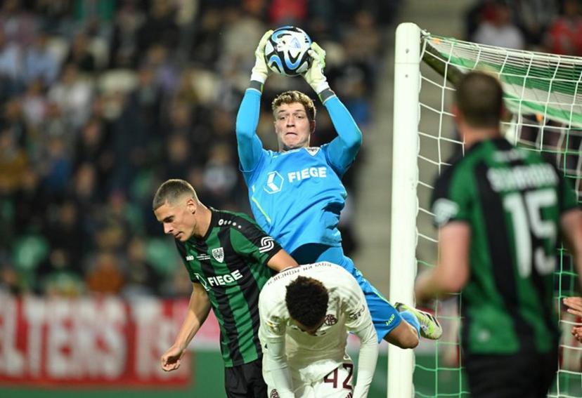Muenster's goalkeeper #40 Johannes Schenk makes a save during the German Cup (DFB Pokal) first round football match SC Preussen Muenster 06 v FC Bayern Munich in Muenster, western Germany, on September 26, 2023. INA FASSBENDER / AFP