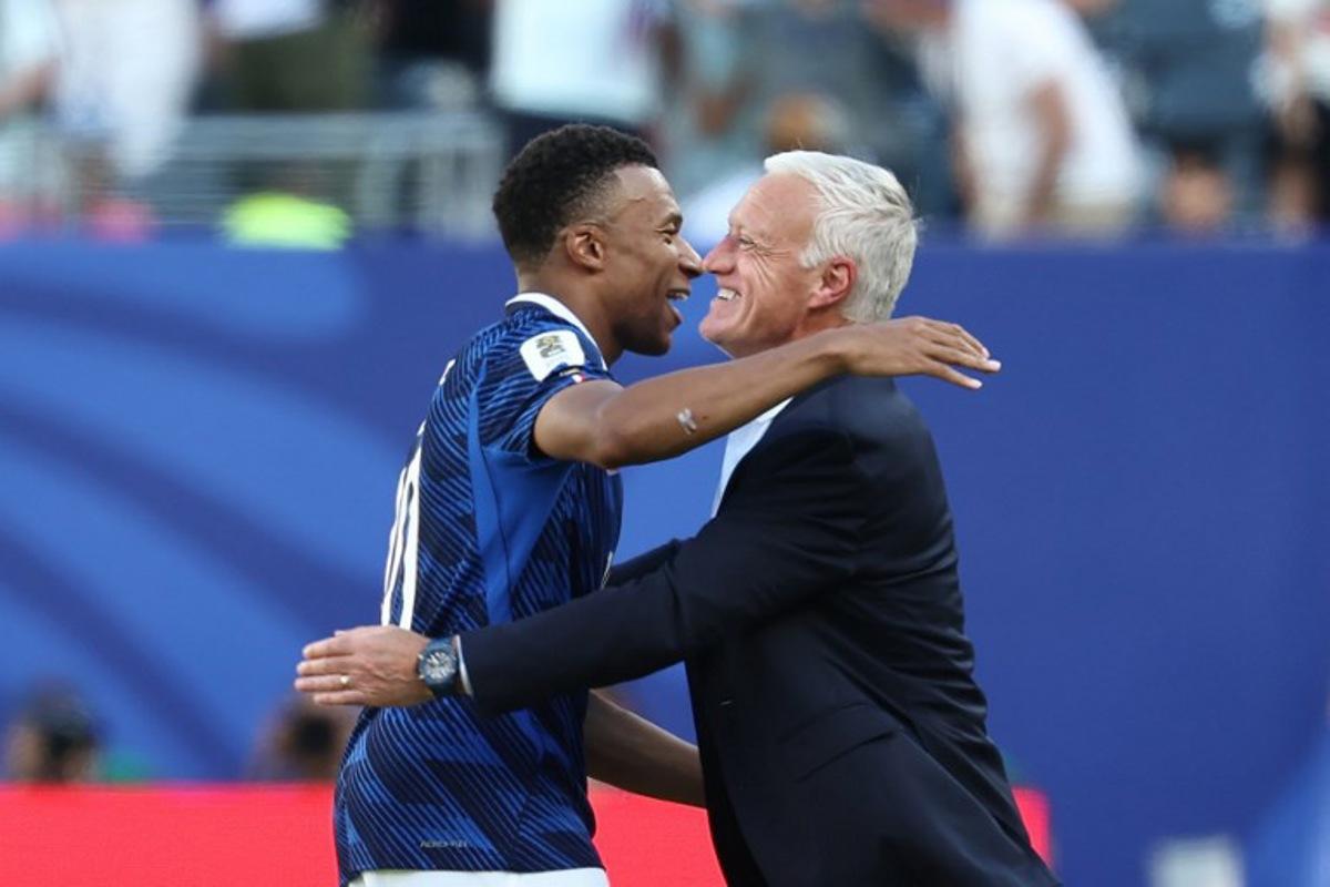 France's head coach Didier Deschamps congratulates his forward #10 Kylian Mbappe after scoring his team's first goal during the 2026 World Cup Group I football match between France and Senegal at the New York/New Jersey Stadium in East Rutherford on June 16, 2026. FRANCK FIFE / AFP