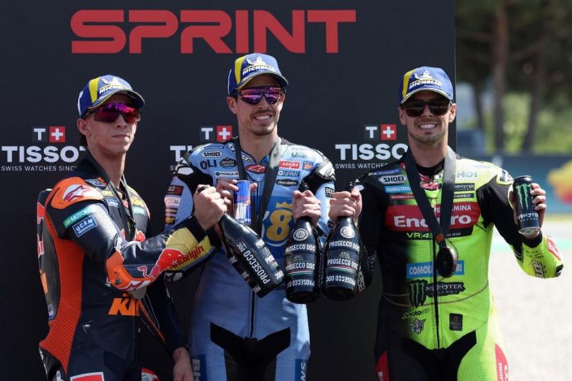 (From L) Team Red Bull KTM Factory Racing's Pedro Acosta, Team Gresini Racing MotoGP's Alex Marquez and Team Pertamina Enduro VR46 Racing Team's Fabio Di Giannantonio celebrate on the podium after the Sprint Race at the Catalunya Moto GP Grand Prix at the Catalunya racetrack in Montmelo, near Barcelona, on May 16, 2026. Lluis GENE / AFP
