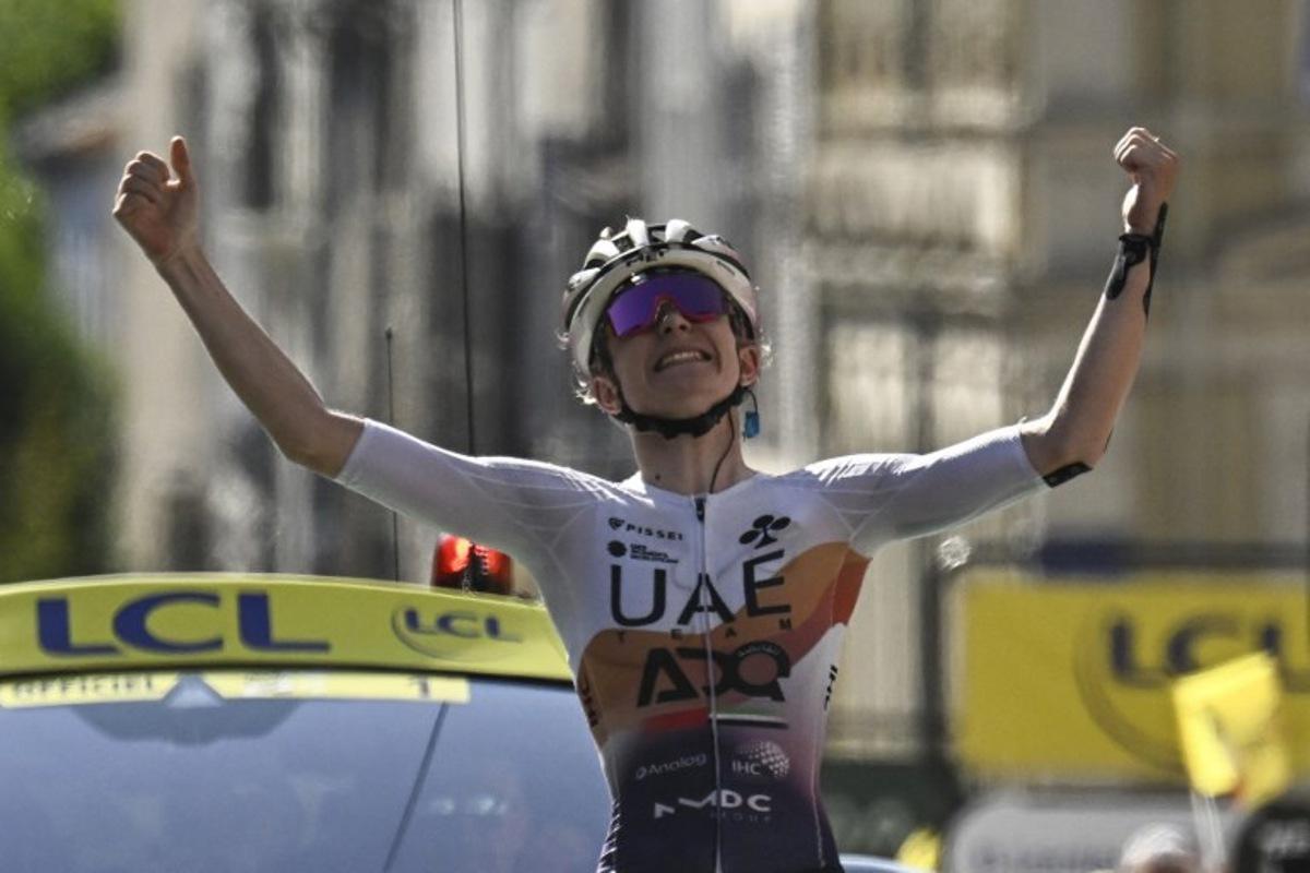 UAE Team ADQ's French rider Maeva Squiban celebrates as she crosses the finish line to win the 6th stage (out of 9) of the fourth edition of the Women's Tour de France cycling race, 123.7 km from Clermont-Ferrand to Ambert, in Ambert, central France on July 31, 2025. JULIEN DE ROSA / AFP