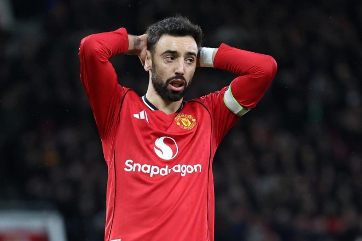 Manchester United's Portuguese midfielder #08 Bruno Fernandes reacts to a missed chance during the English Premier League football match between Manchester United and Everton at Old Trafford in Manchester, north west England, on November 24, 2025. Darren Staples / AFP