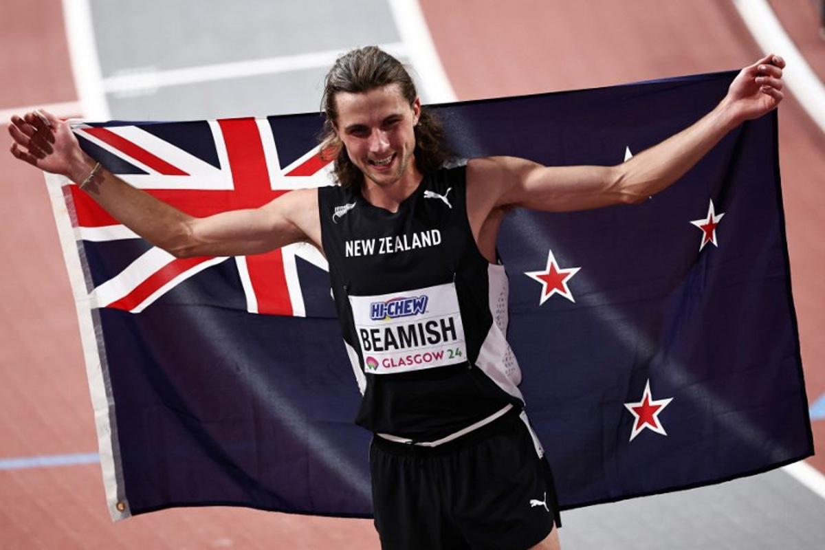 First-placed New Zealand's Geordie Beamish celebrates after winning in the Men's 1500m final during the Indoor World Athletics Championships in Glasgow, Scotland, on March 3, 2024. Anne-Christine POUJOULAT / AFP