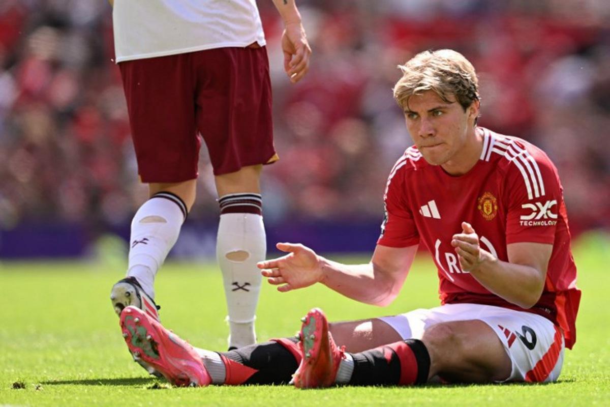 Manchester United's Danish striker #09 Rasmus Hojlund reacts to a missed chance during the English Premier League football match between Manchester United and West Ham United at Old Trafford in Manchester, north west England, on May 11, 2025. Oli SCARFF / AFP